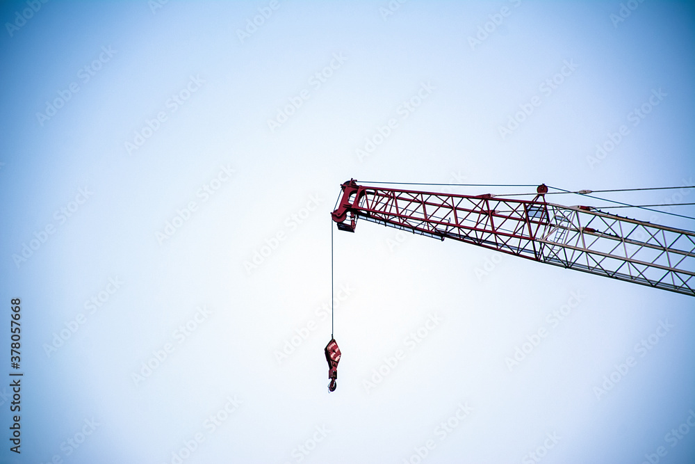 Mechanical tower crane at construction site