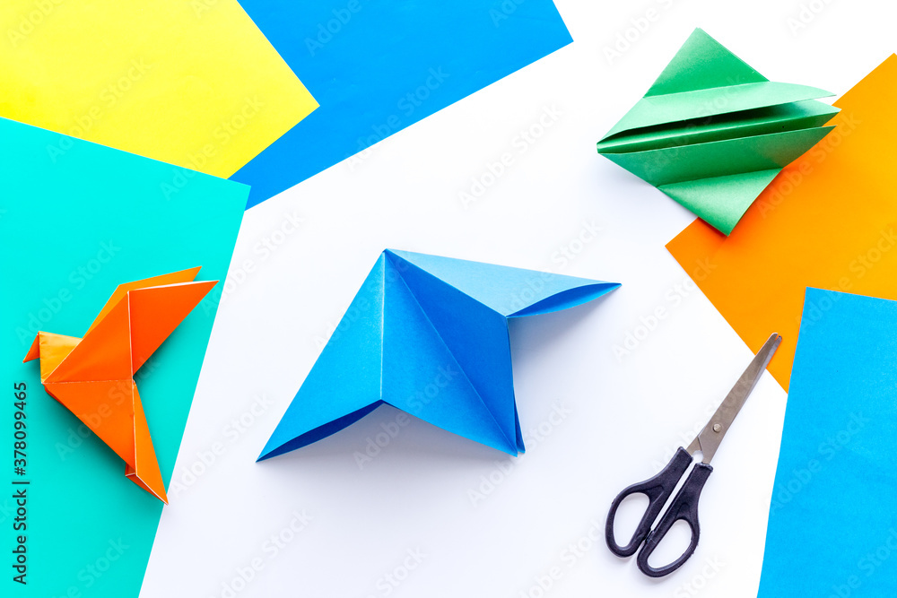 DIY concept. Doing origami paper bird, Top view