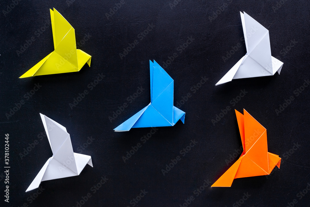 Paper pigeons in origami technique. DIY creativity. View from above