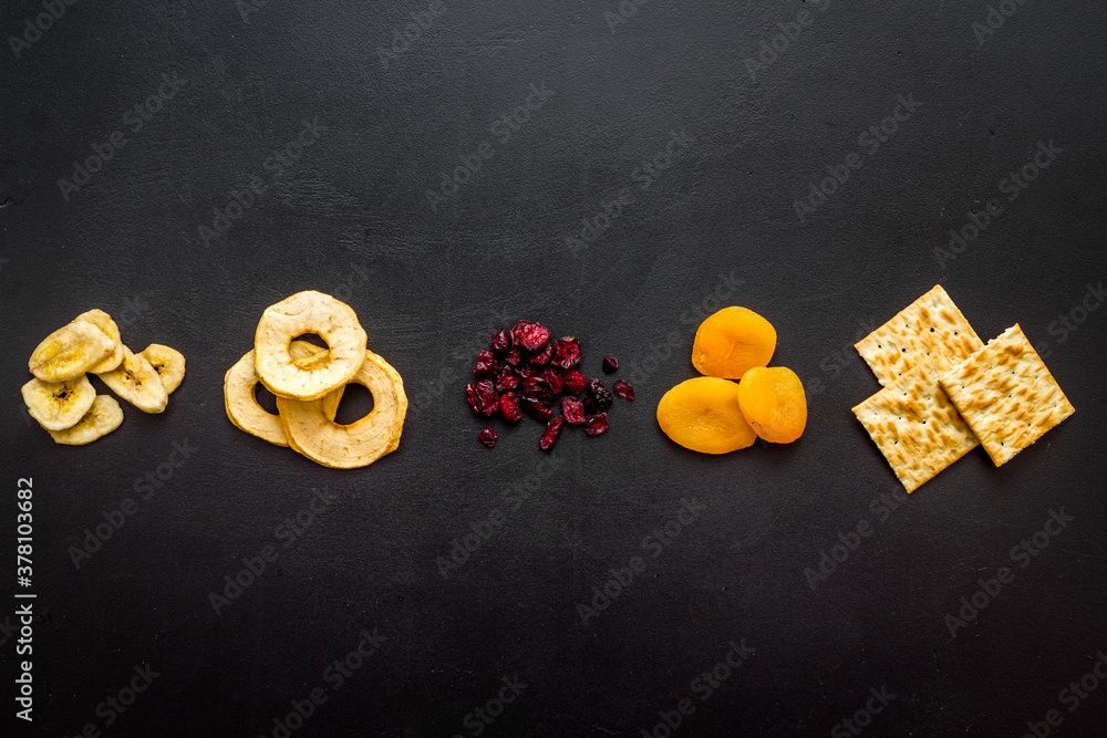 Flat lay of appetizers and snacks overhead. Nuts and dried fruits with crackers