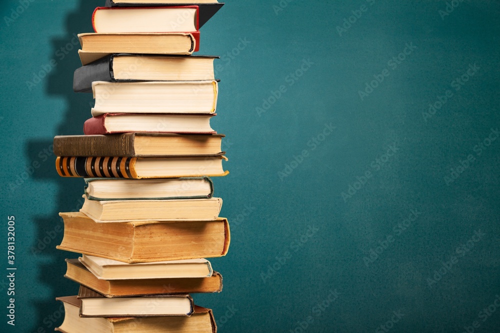 Collection stack of old retro books on background