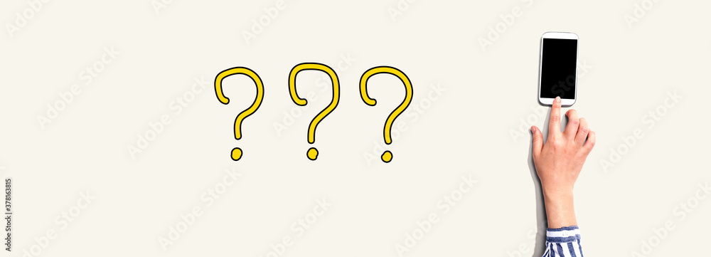 Question marks with person using a smartphone