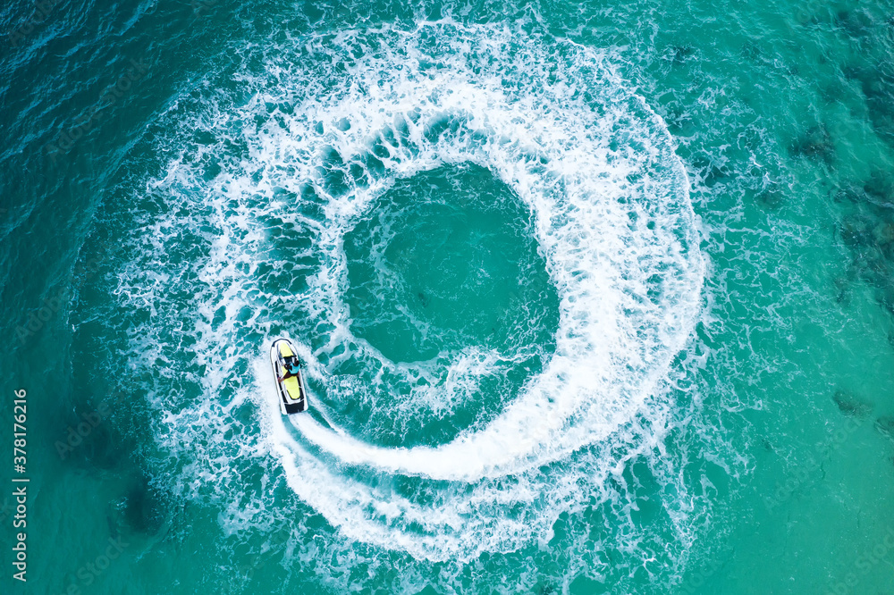 People are playing a jet ski in the sea.Aerial view. Top view.amazing nature background. The color o