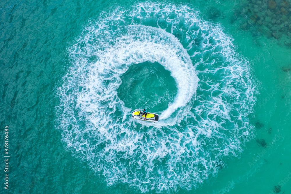 People are playing a jet ski in the sea.Aerial view. Top view.amazing nature background. The color o