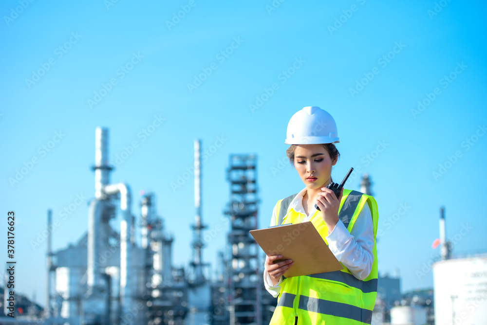 Engineer inspecting in industrial oil refinery. Industry 4.0 concept. Background blurred concept.