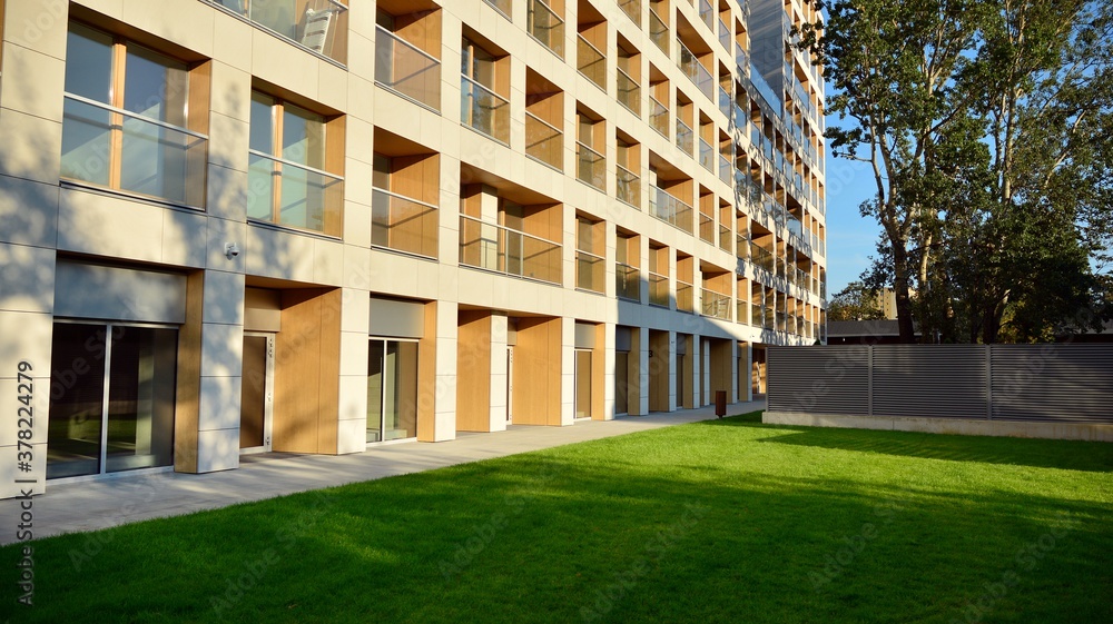 Contemporary residential building exterior in the daylight. Modern apartment buildings on a sunny da