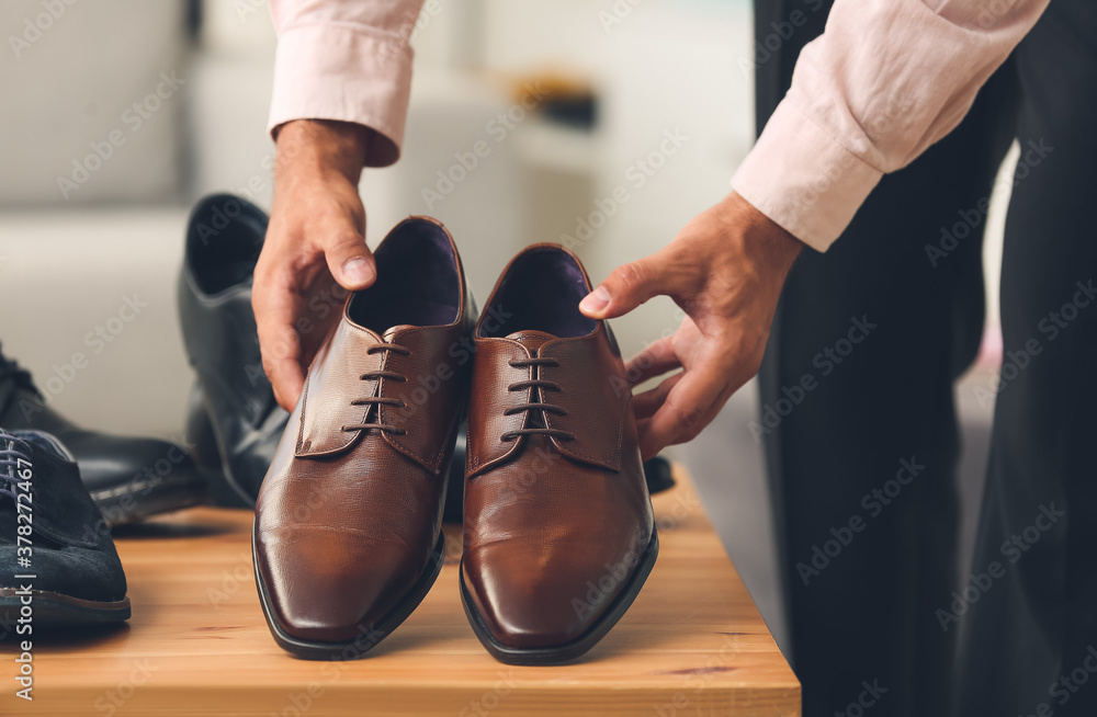 Male seller in shoe store