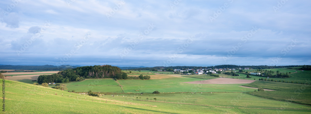 village in landscape of german eifel in summer