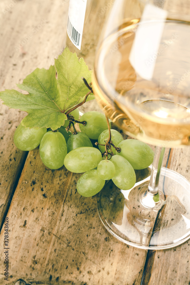 Wine composition with glass of wine and grape, close up