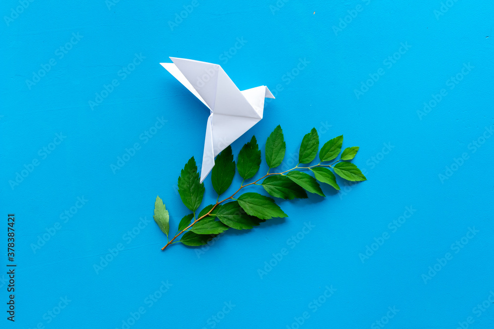 Origami pigeon. World Peace Day, care concept. Top view