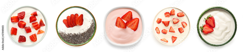 Bowls of healthy strawberry yogurt on white background