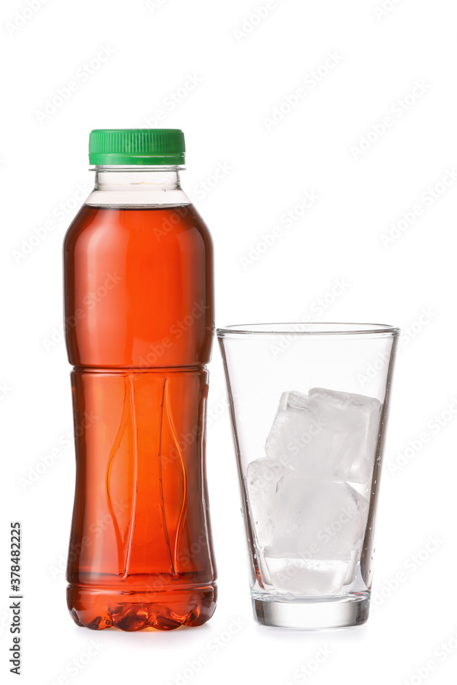 Bottle of fresh tea and glass with ice on white background