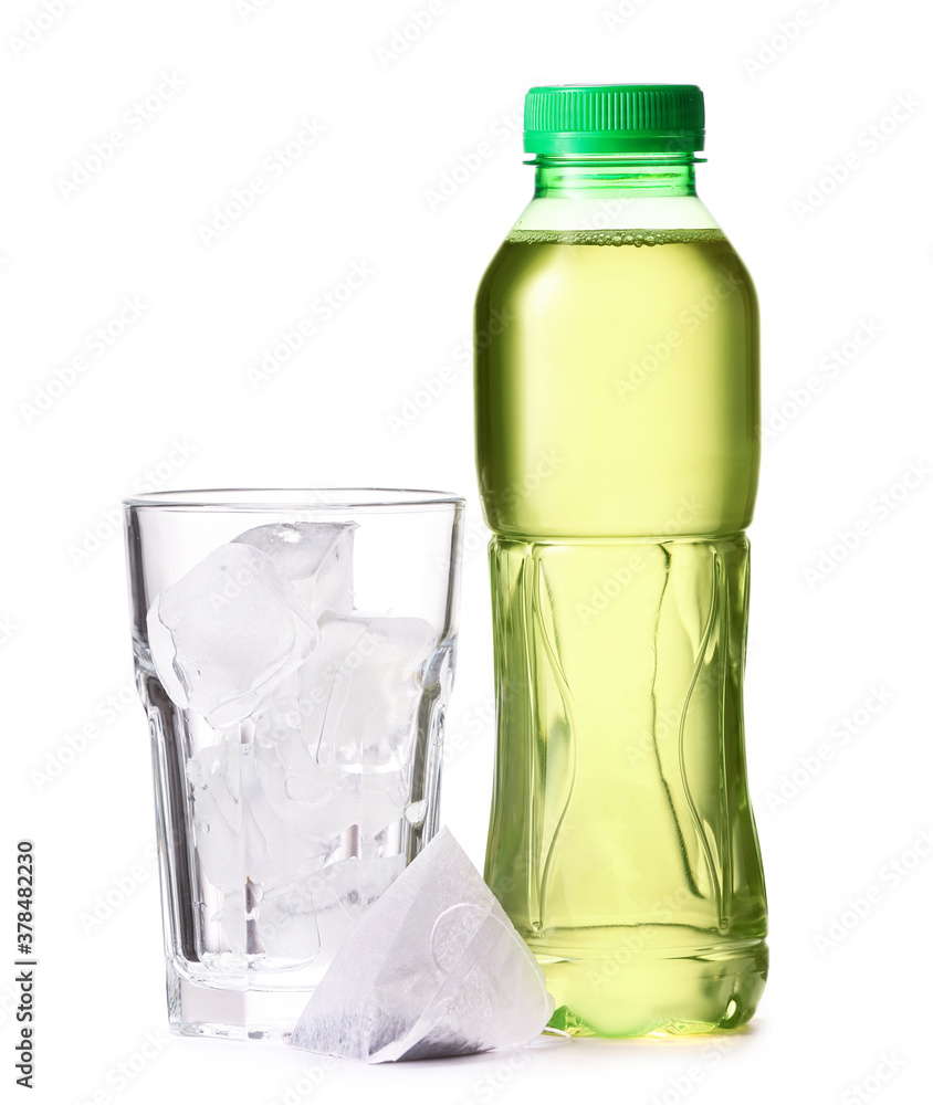 Bottle of fresh tea and glass with ice on white background