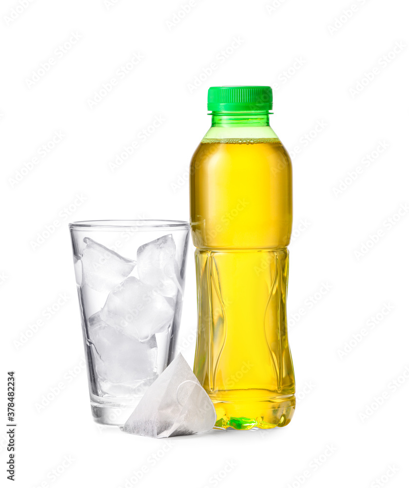 Bottle of fresh tea and glass with ice on white background