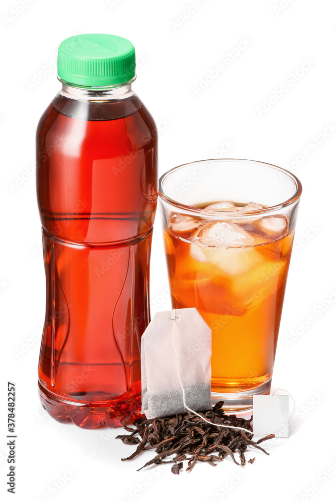 Bottle and glass of fresh ice tea on white background