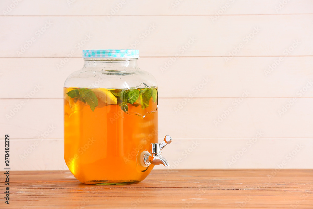 Jar of fresh ice tea on table