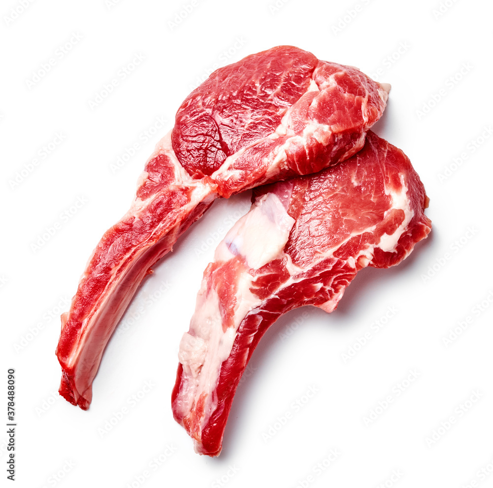 Two slices of mutton meat isolated on white. Top view of mutton steaks.