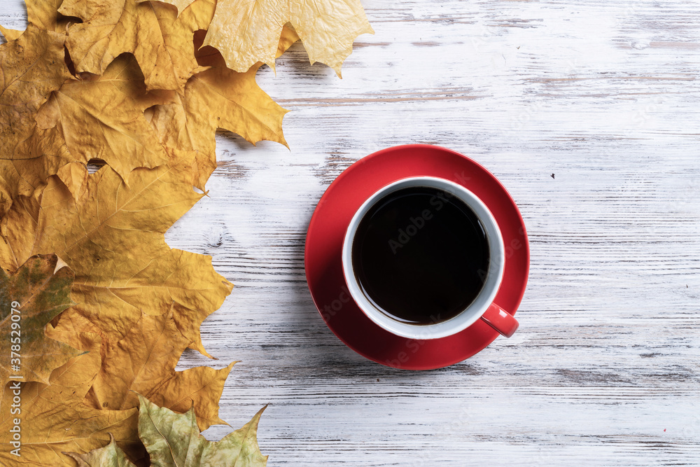 Flat lay autumn composition with cup of black tea