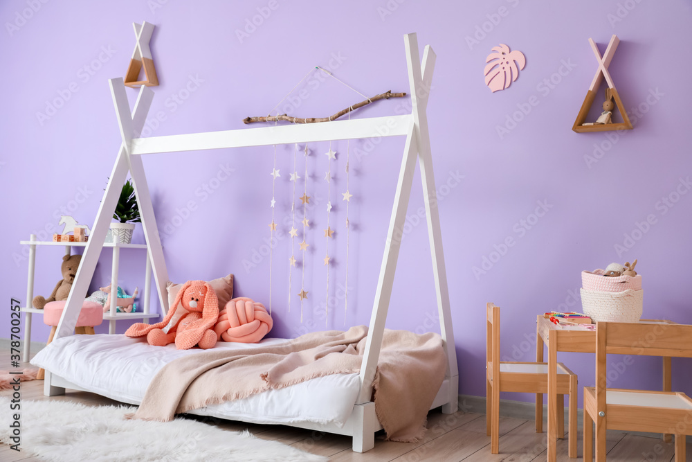 Interior of modern childrens room with comfortable bed