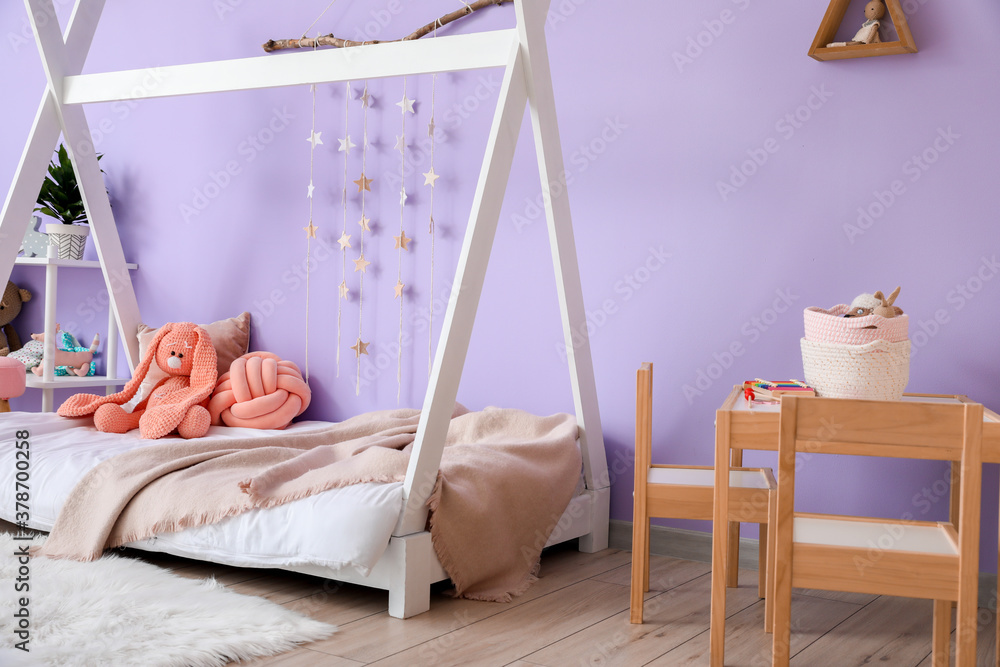 Interior of modern childrens room with comfortable bed