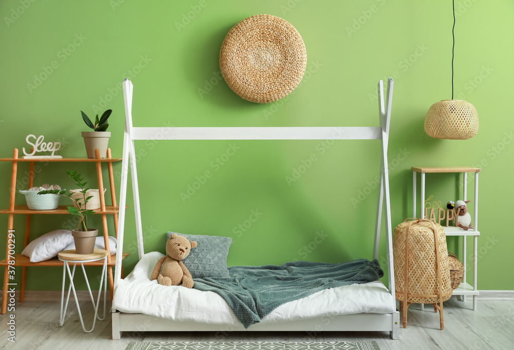 Interior of modern childrens room with comfortable bed