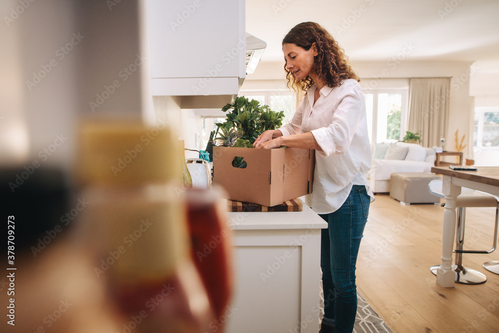 Woman checking her fresh vegetable delivery