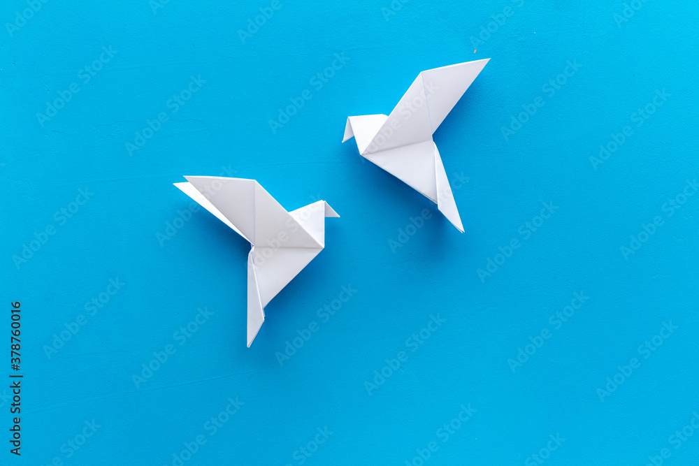 Origami birds are flying, overhead top view