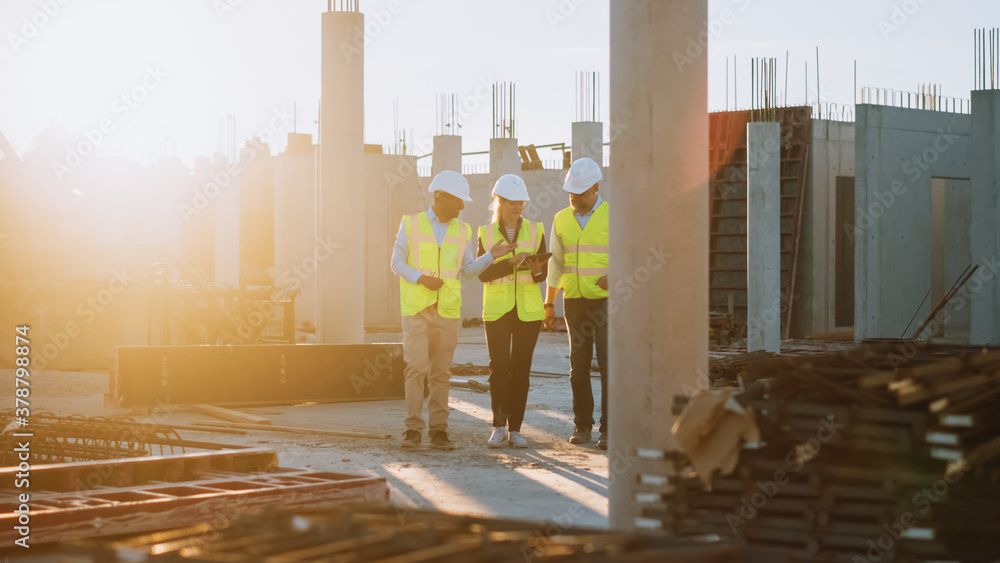 Diverse Team of Specialists Taking a Walk Through Construction Site. Real Estate Building Project wi