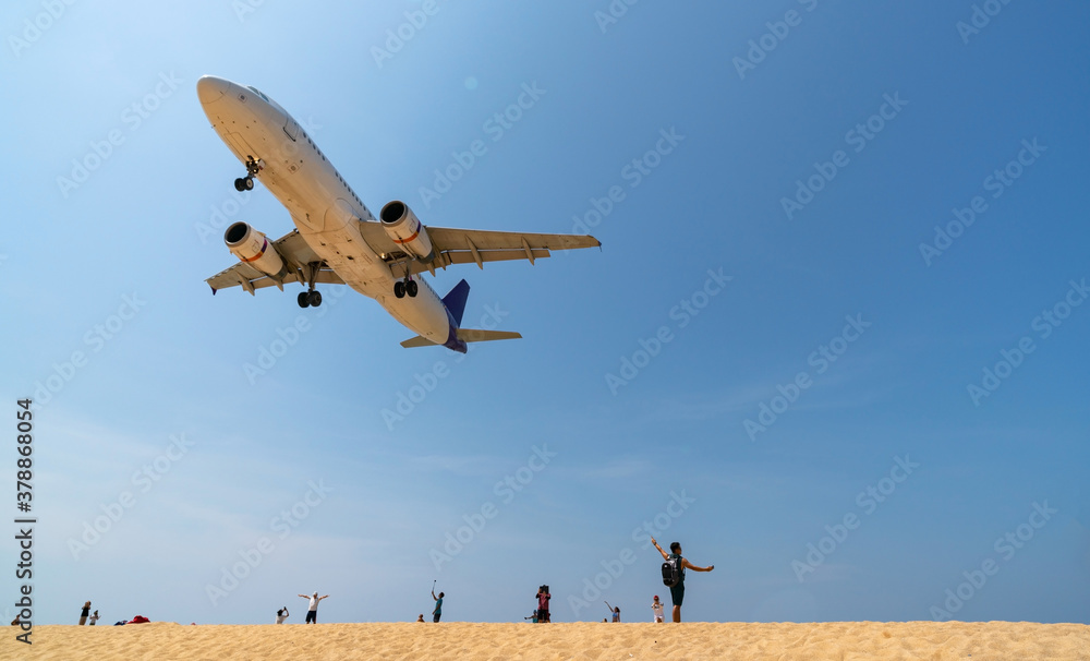 Phuket Thailand Airplane Landing over sea at Phuket Airport, Mai Khao beach phuket thailand popular 