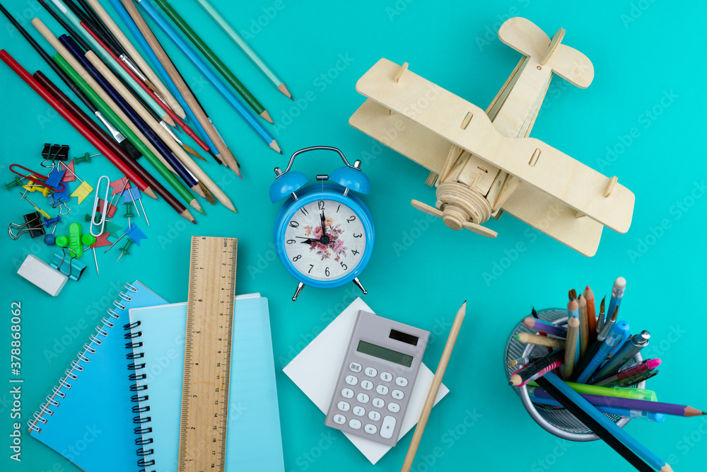 Back to school background with School supplies on green paper background.