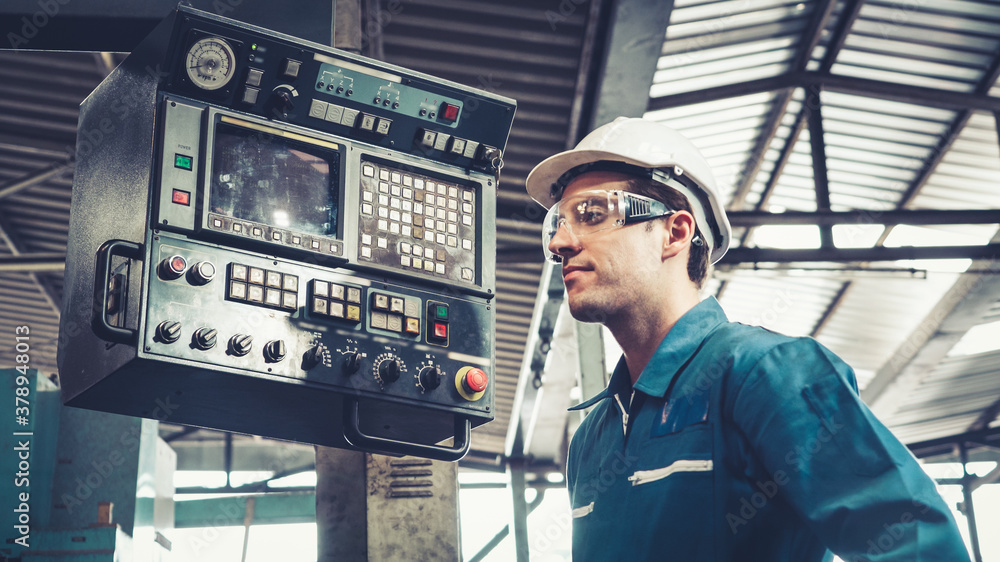 Smart factory worker using machine in factory workshop . Industry and engineering concept.