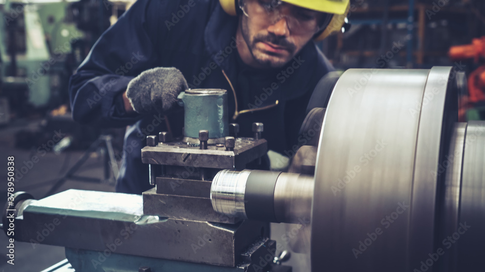 Smart factory worker using machine in factory workshop . Industry and engineering concept.