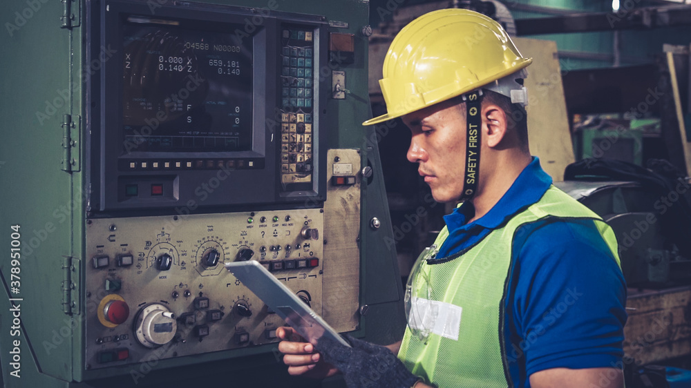 Smart factory worker using machine in factory workshop . Industry and engineering concept.