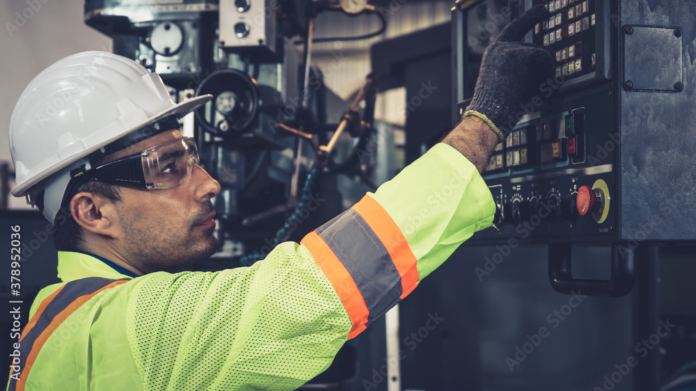 Smart factory worker using machine in factory workshop . Industry and engineering concept.