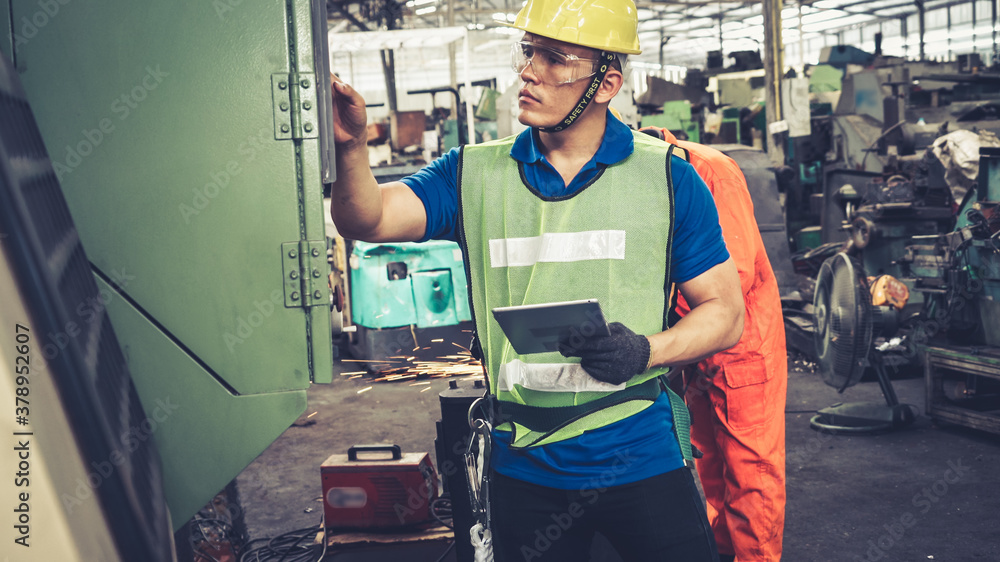 Smart factory worker using machine in factory workshop . Industry and engineering concept.