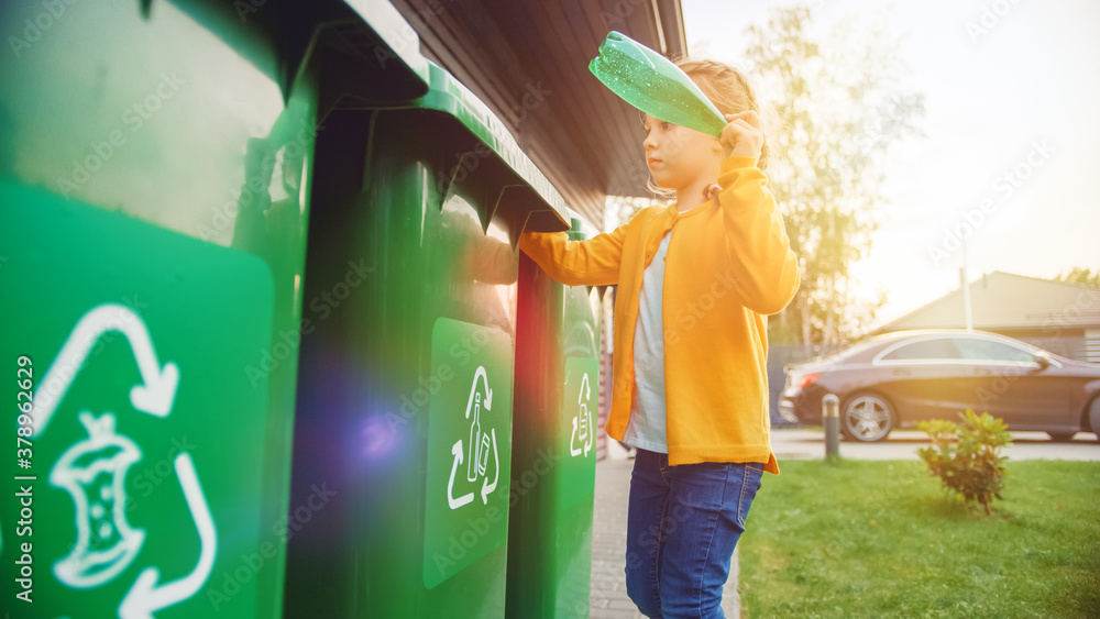 Young Girl is Throwing Away an Empty Plastic Bottle into a Trash Bin. She Uses Correct Garbge Bin Be