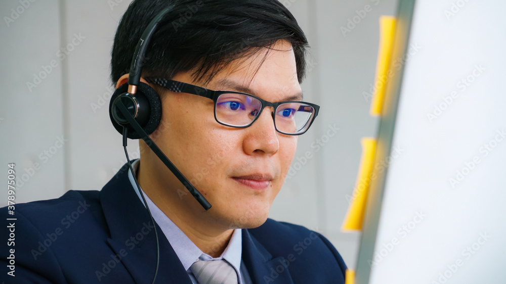 Business people wearing headset working in office to support remote customer or colleague. Call cent