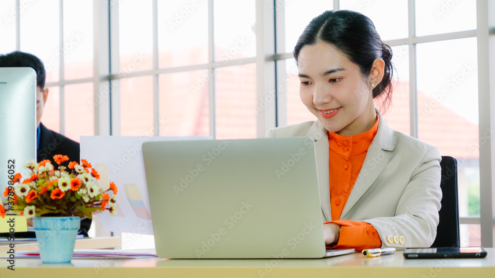 Business people working at table in modern office room while analyzing financial data report .