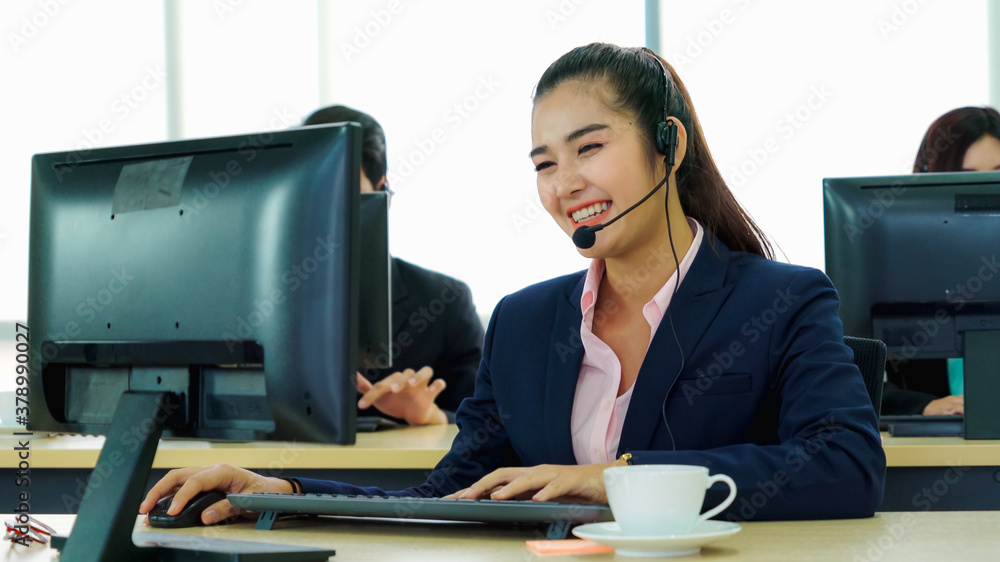 Business people wearing headset working in office to support remote customer or colleague. Call cent