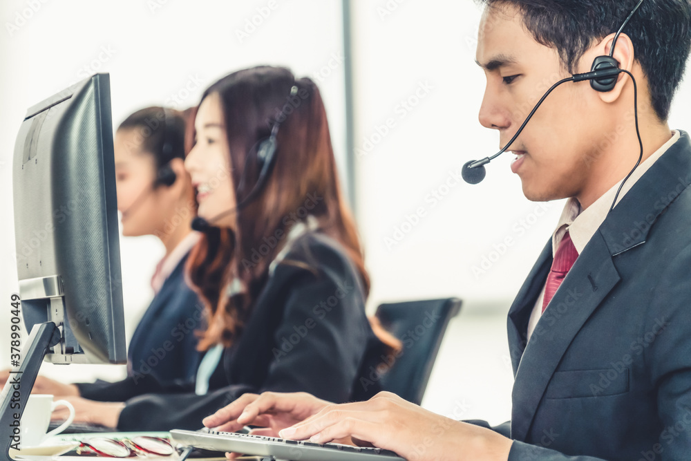 Business people wearing headset working in office to support remote customer or colleague. Call cent