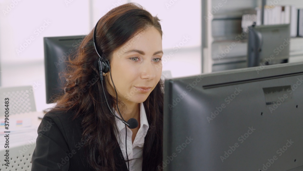 Business people wearing headset working in office to support remote customer or colleague. Call cent