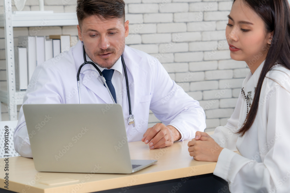 Doctor in professional uniform examining patient at hospital or medical clinic. Health care , medica