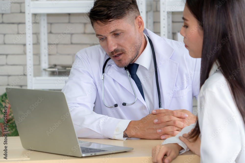 Doctor in professional uniform examining patient at hospital or medical clinic. Health care , medica