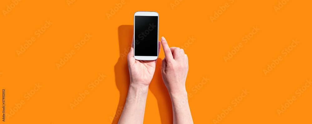 Person using a white smartphone from above