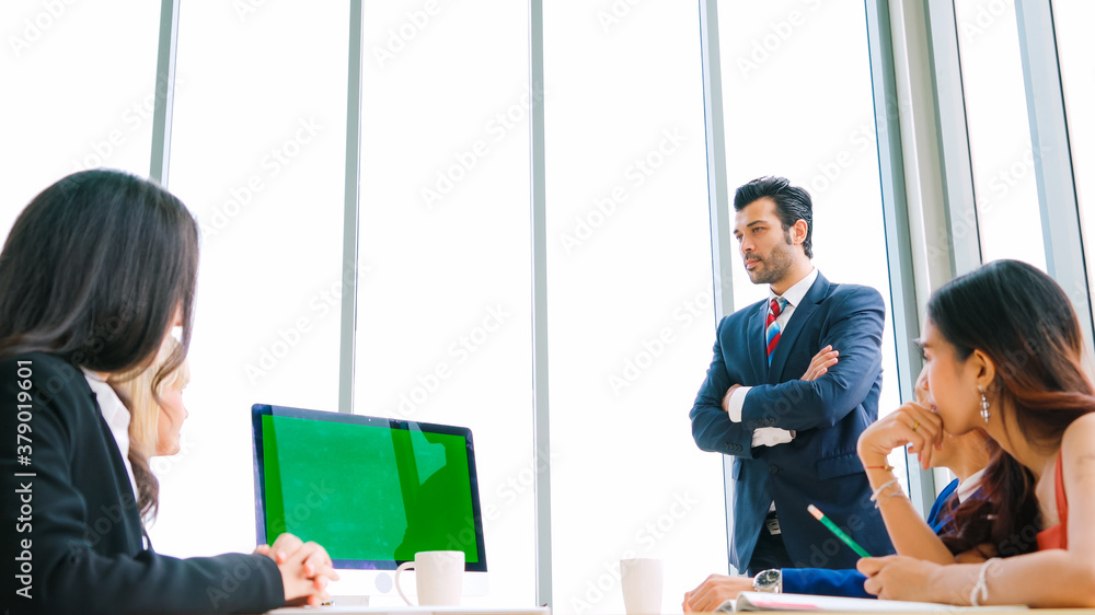 Business people in the conference room with green screen chroma key TV or computer on the office tab