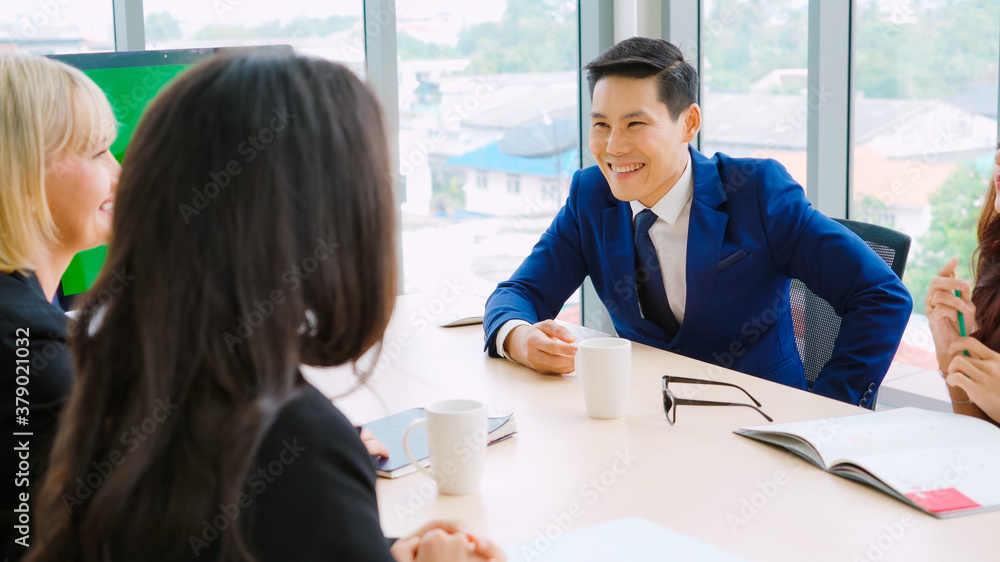 Business people in the conference room with green screen chroma key TV or computer on the office tab