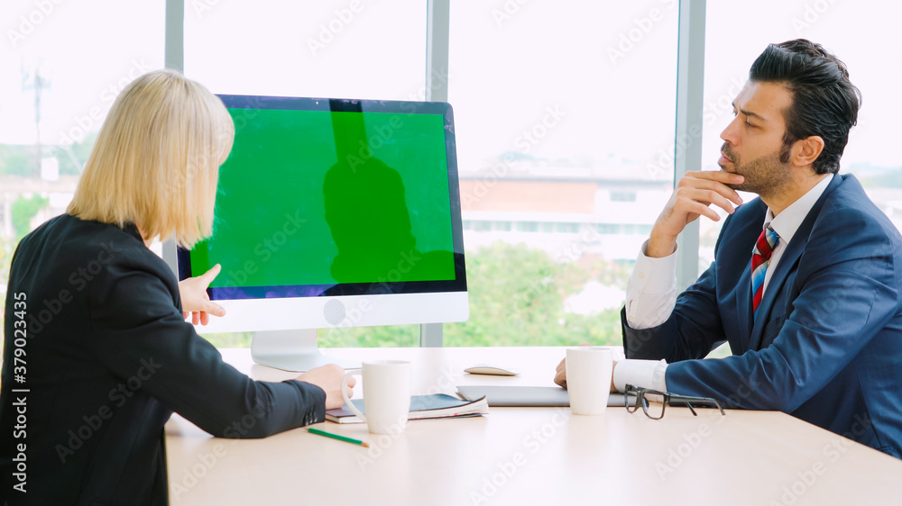 Business people in the conference room with green screen chroma key TV or computer on the office tab