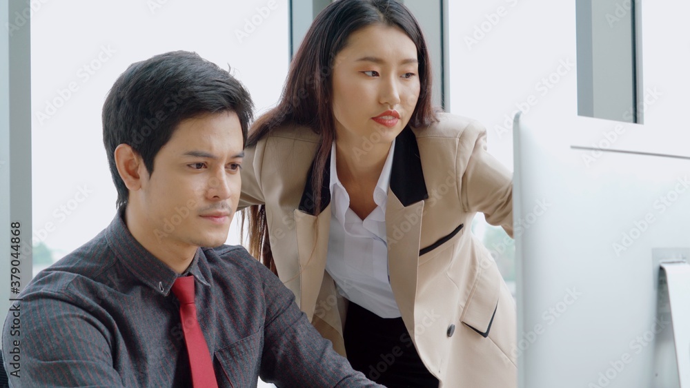 Two business people talk project strategy at office meeting room. Businessman discuss project planni