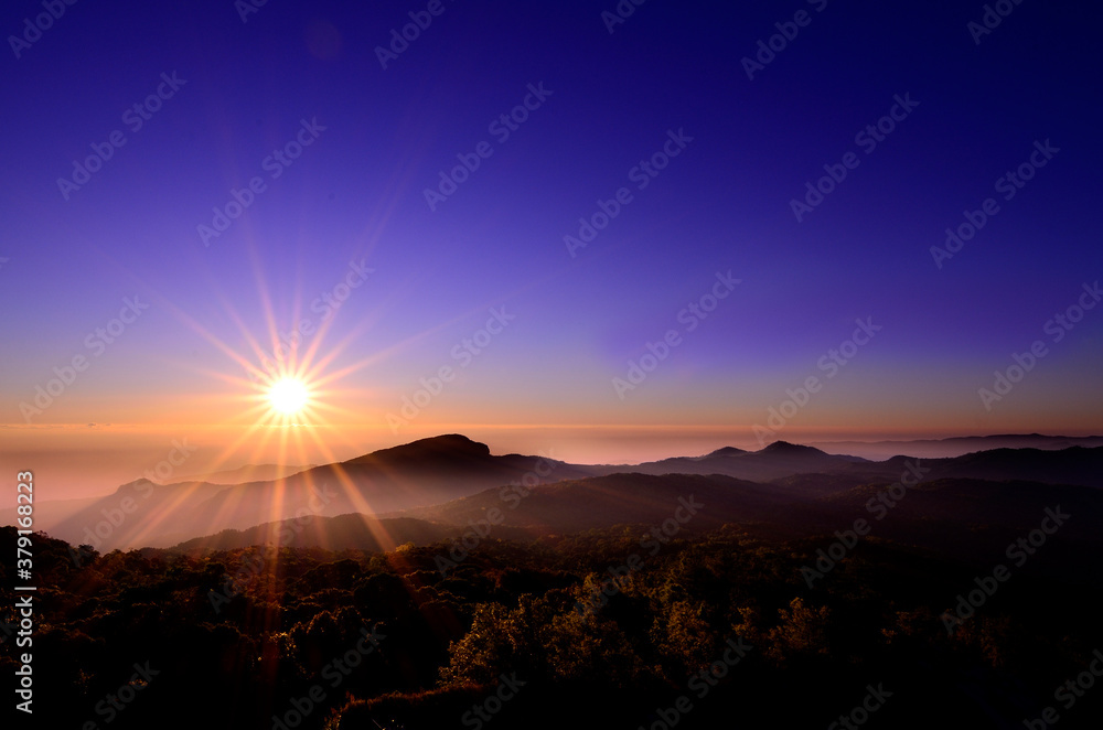 beautiful Sunrise over tiger nose mountain with spread of fog in early morning moment