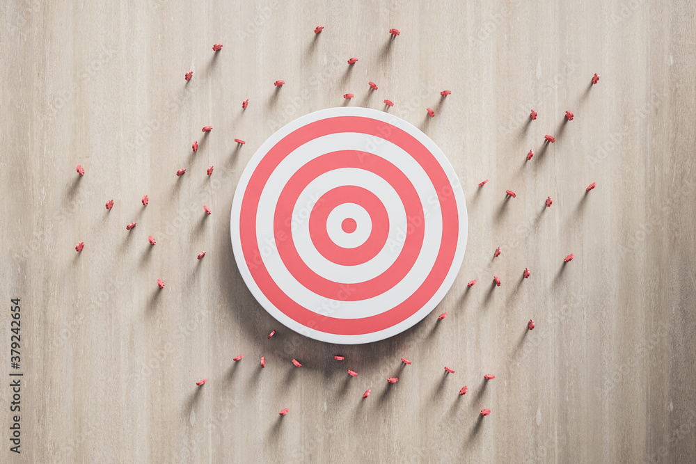 Red dart board with 3d people on wooden wall.